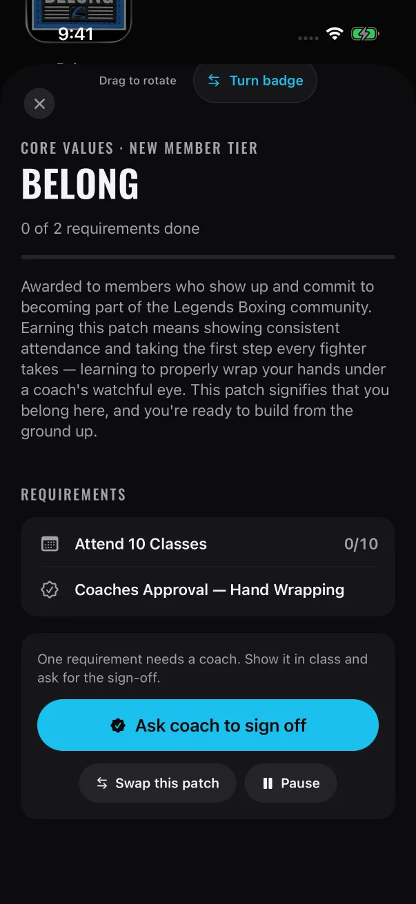 The seal icon marks the requirement a coach signs off, and the button to ask is in the card under the list.