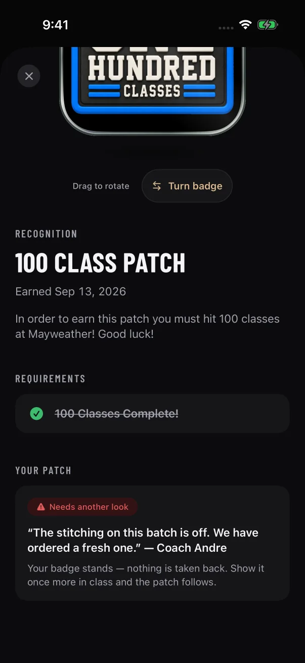 Your coach's words are quoted under the red chip, and the badge stays earned.